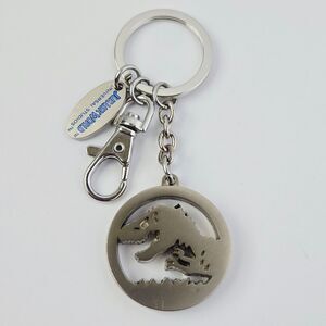 Universal Studios Jurassic World Park Keychain T-Rex Logo Silver Brushed Metal